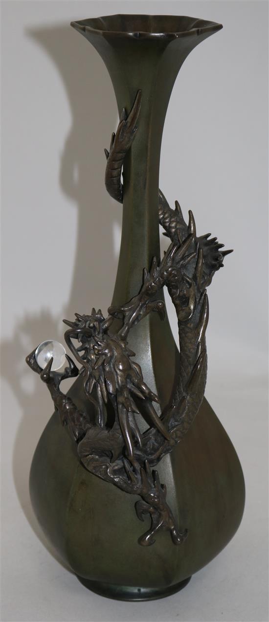 A Japanese bronze dragon hexagonal bottle vase, c.1880, 35.5cm